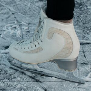 person wearing white nike sneakers
